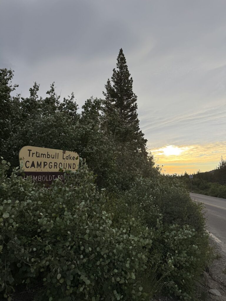 Campground sign at sunset.