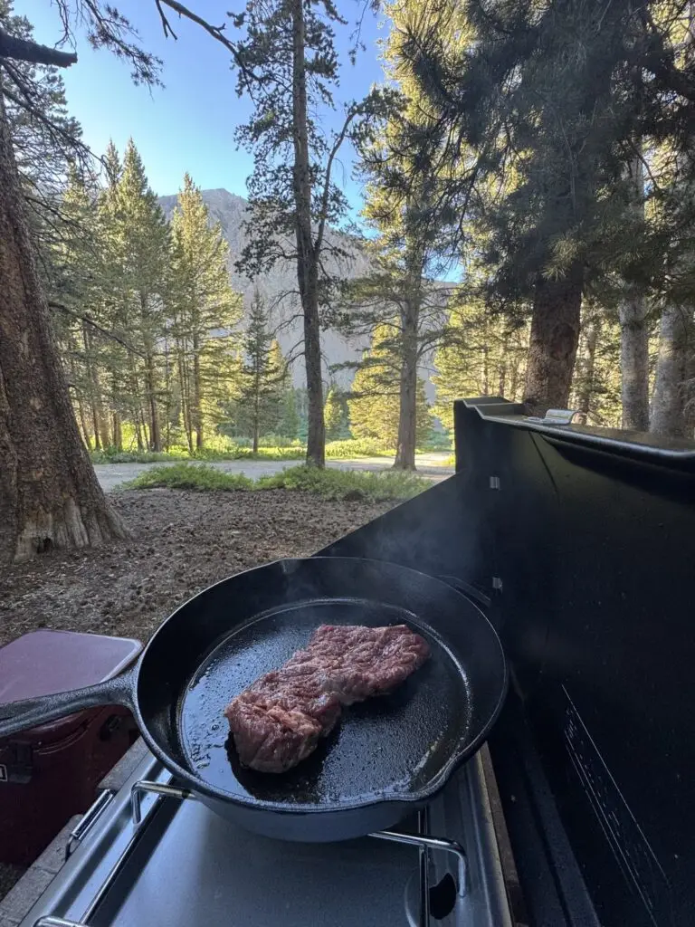 Cooking up some steak tacos on the picnic table at camp.